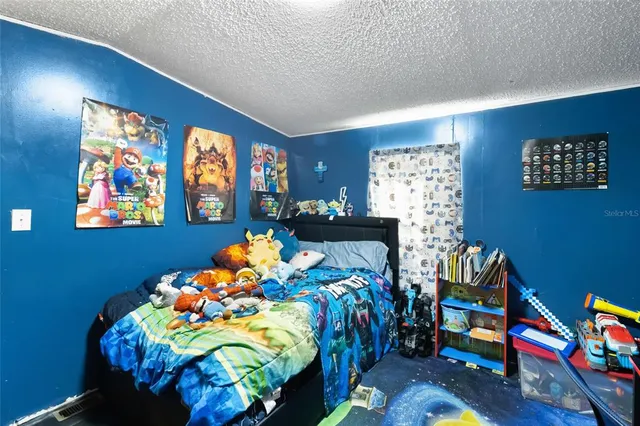 a bathroom with a sink a toilet and shower curtain