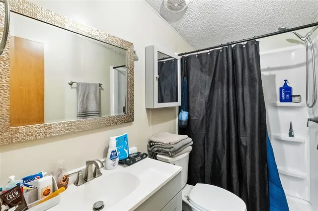 a view of a house with a yard and garage