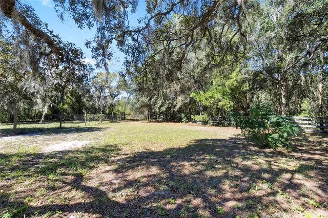 a view of a lake with a yard