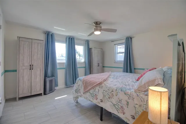 a view of a livingroom with furniture and a ceiling fan