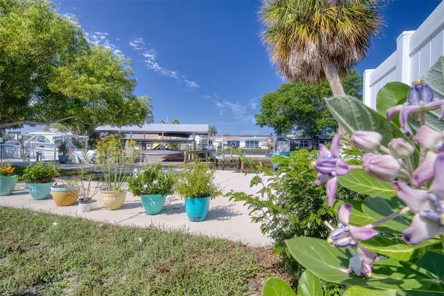 an aerial view of a house with a yard and lake view