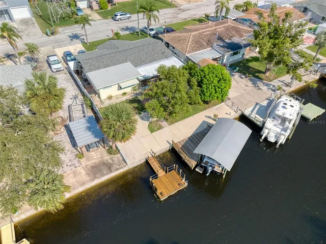 an outdoor sitting area with furniture and a potted plant