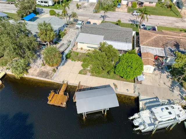 an aerial view of a house with outdoor space