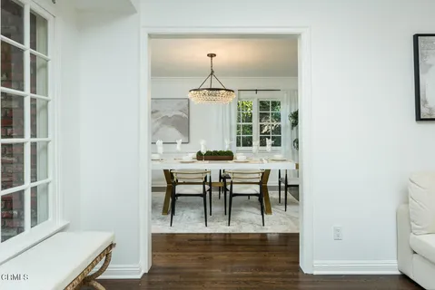 a bedroom with a couch ceiling fan and a couch