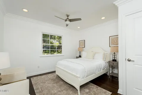 a bedroom with a bed and a view of bedroom