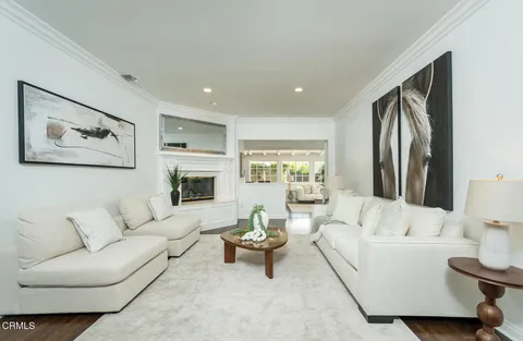 a living room with furniture or fireplace and a wooden floor