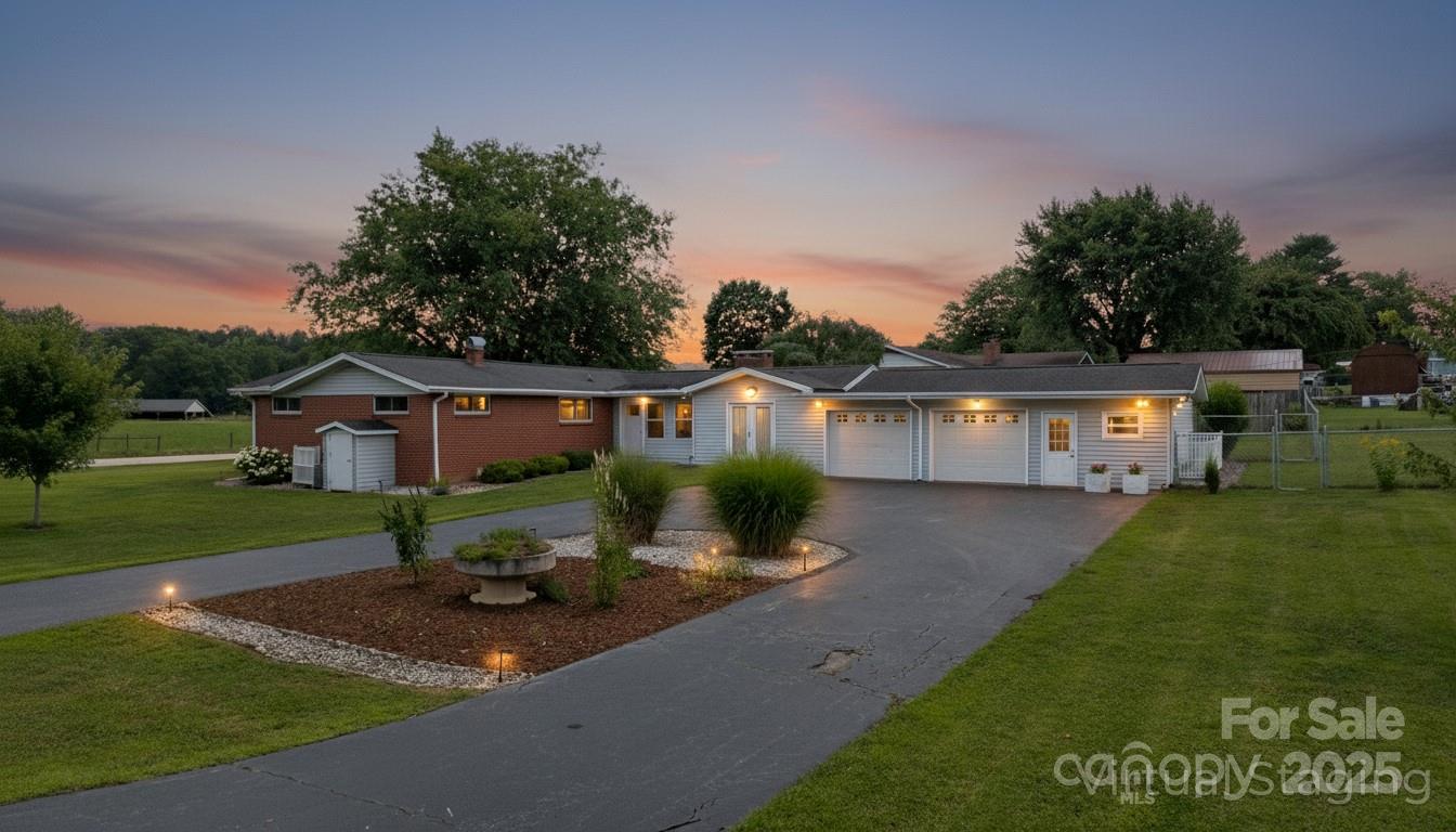 a front view of house with yard and green space