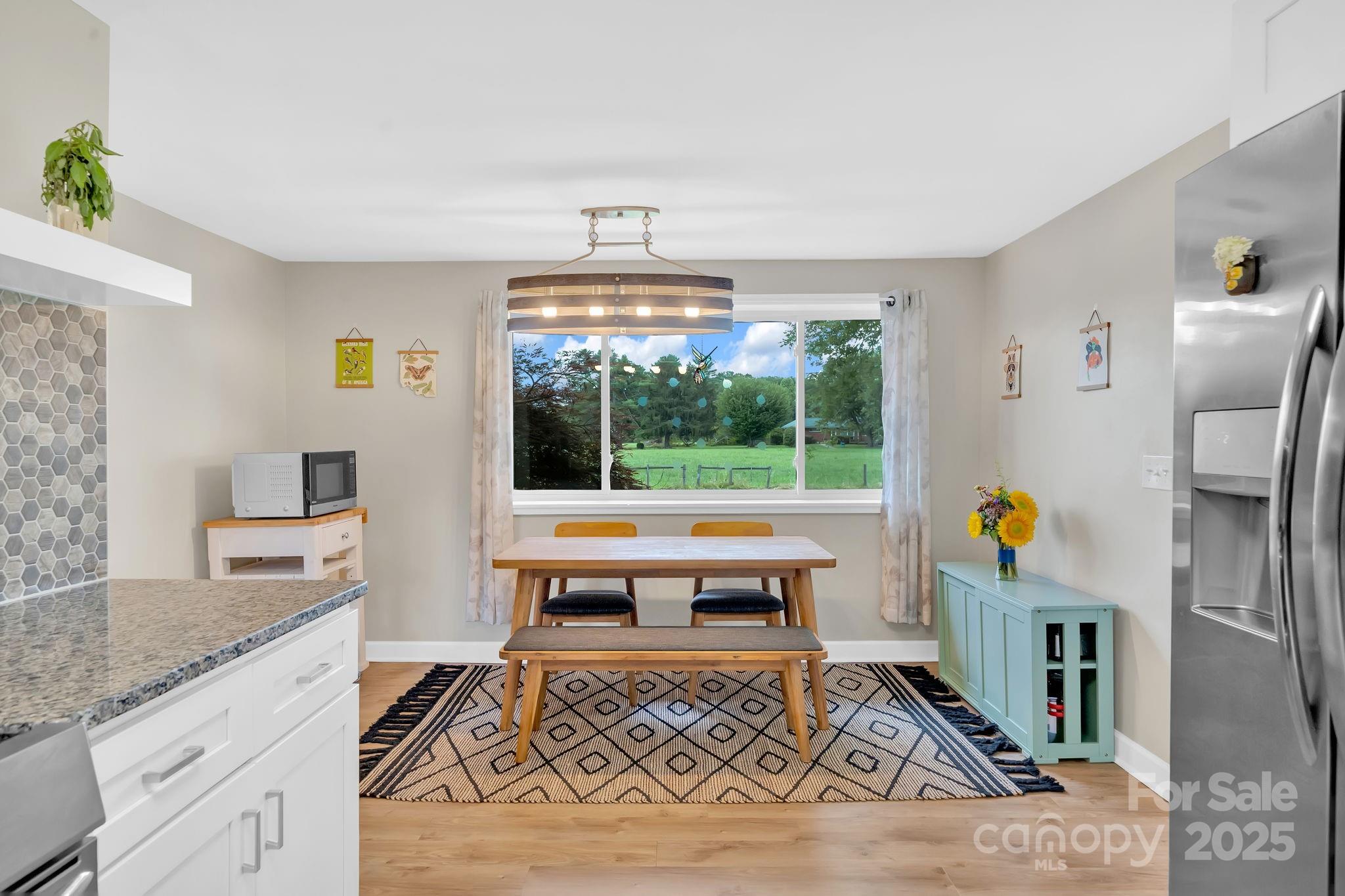10 Moland Drive Etowah, NC 28729 - Photo 11 of 26 a living room with furniture and a table