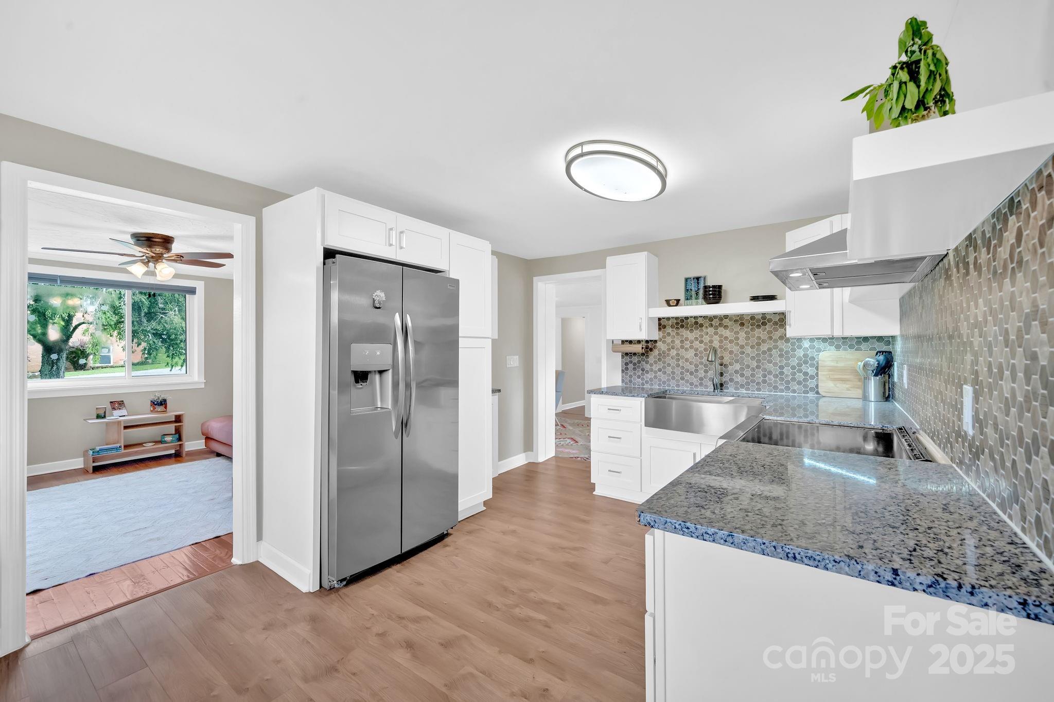 10 Moland Drive Etowah, NC 28729 - Photo 13 of 26 a view of a kitchen with kitchen island a counter top space and stainless steel appliances