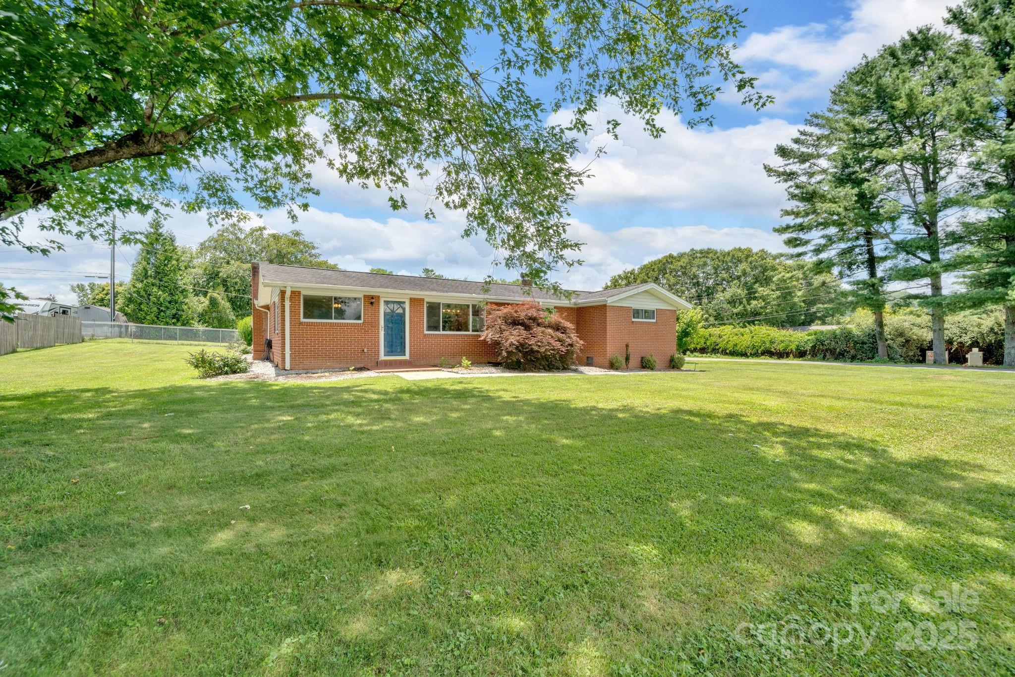 10 Moland Drive Etowah, NC 28729 - Photo 2 of 26 a front view of house with yard and green space