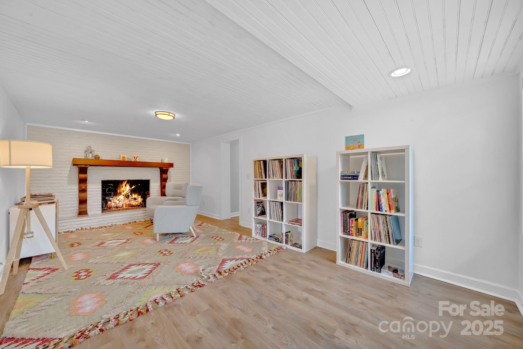 10 Moland Drive Etowah, NC 28729 - Photo 21 of 26 a bedroom with a bed and a book shelf