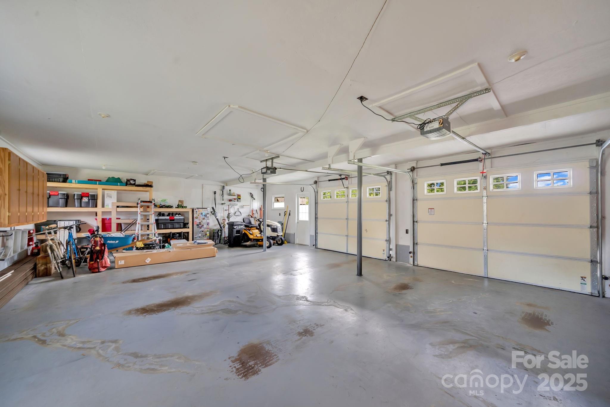 10 Moland Drive Etowah, NC 28729 - Photo 23 of 26 a view of parking garage with cars