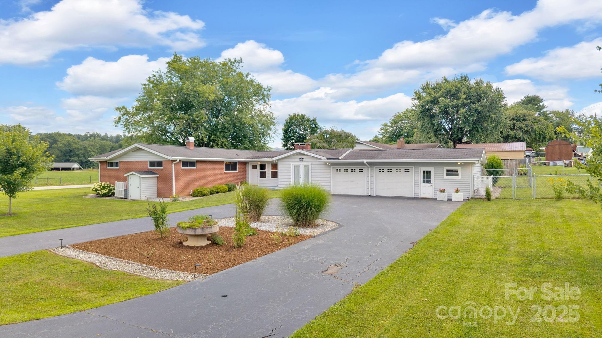 10 Moland Drive Etowah, NC 28729 - Photo 24 of 26 a view of house with garden