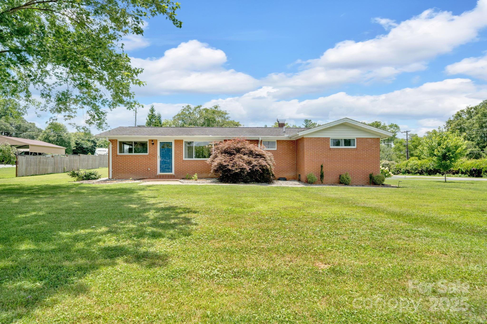 10 Moland Drive Etowah, NC 28729 - Photo 25 of 26 a view of a house with a garden