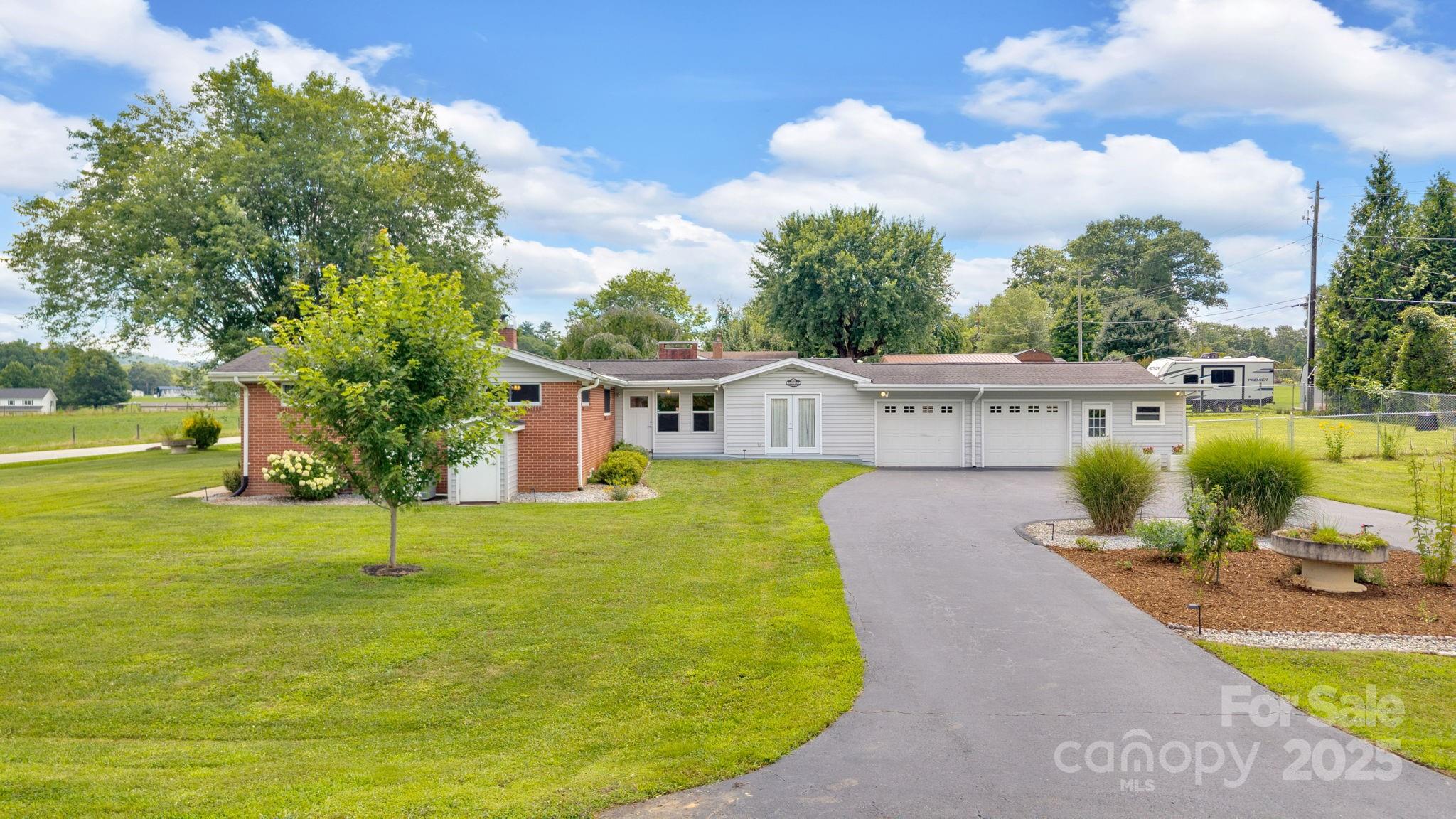 10 Moland Drive Etowah, NC 28729 - Photo 6 of 26 a view of a swimming pool with a patio