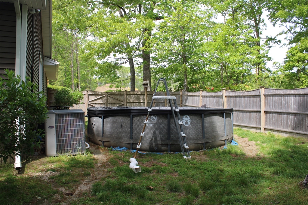 225 Braemoor Road Brockton, MA 02301 - Photo 6 of 29 a view of a backyard with large tree