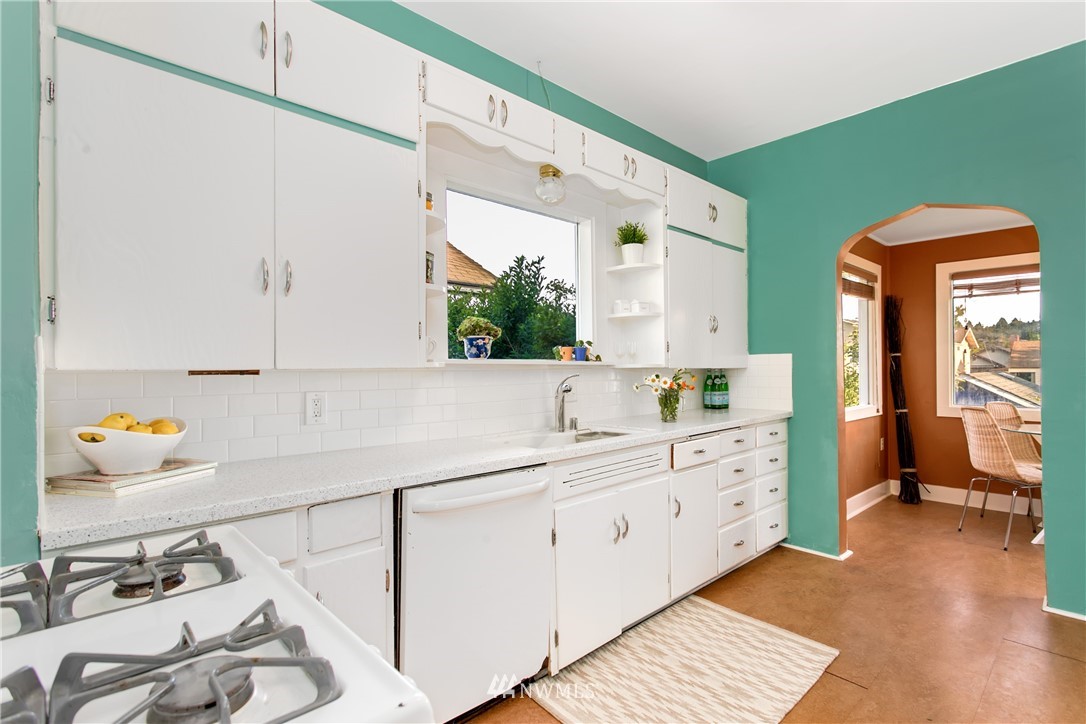 731 North 68th Street Seattle, WA 98103 - Photo 7 of 25 a kitchen with sink and cabinets