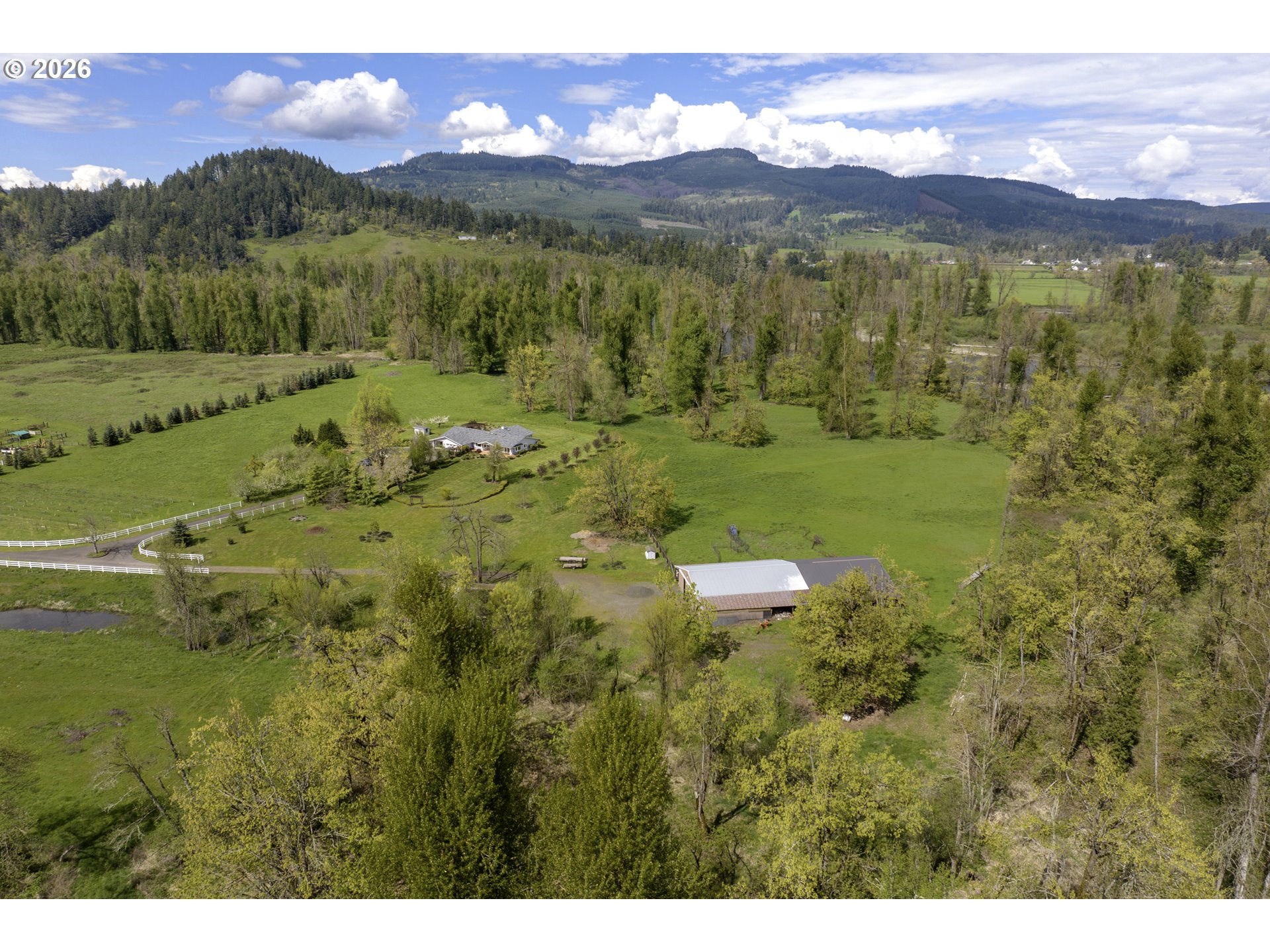 7924 Thurston Road Springfield, OR 97478 - Photo 42 of 45 a view of a lush green hillside and a houses