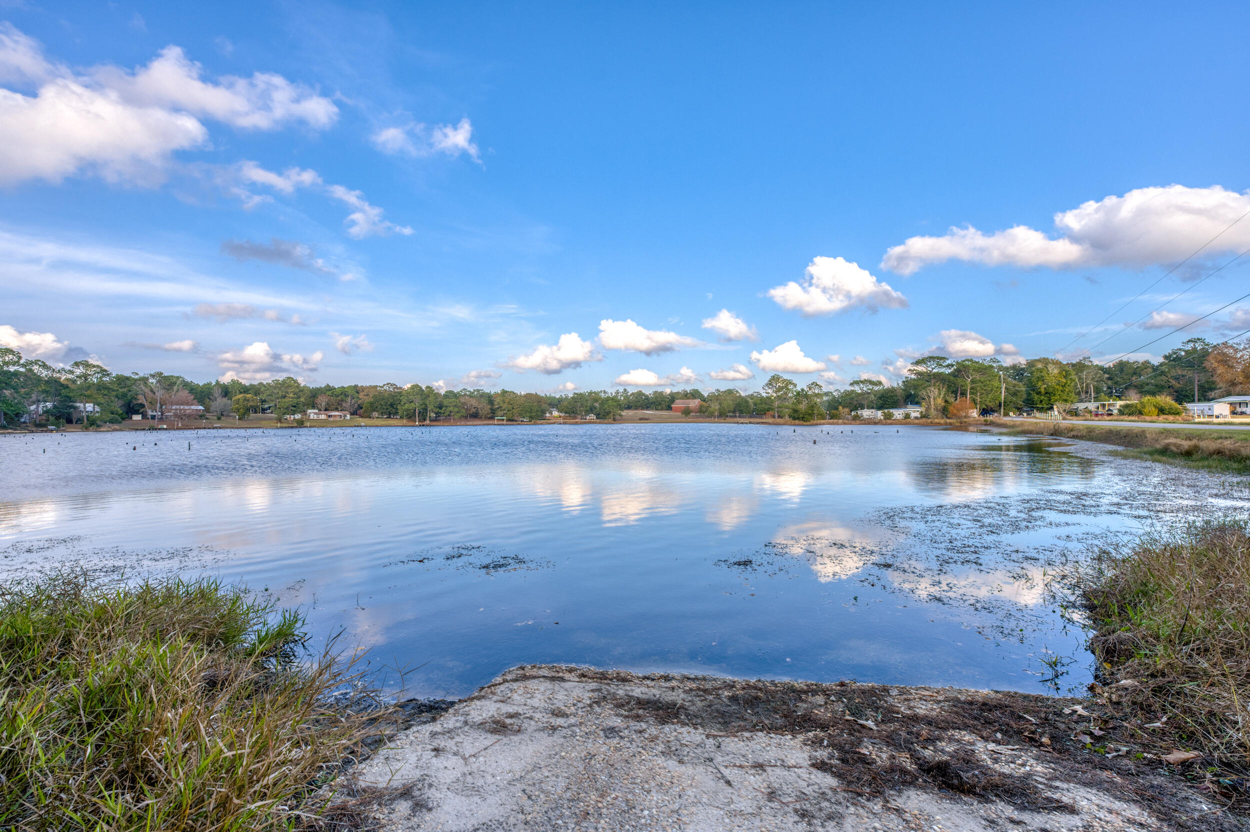 281 Pipers Landing Road DeFuniak Springs, FL 32433 - Photo 11 of 22 a view of a lake with houses in the background
