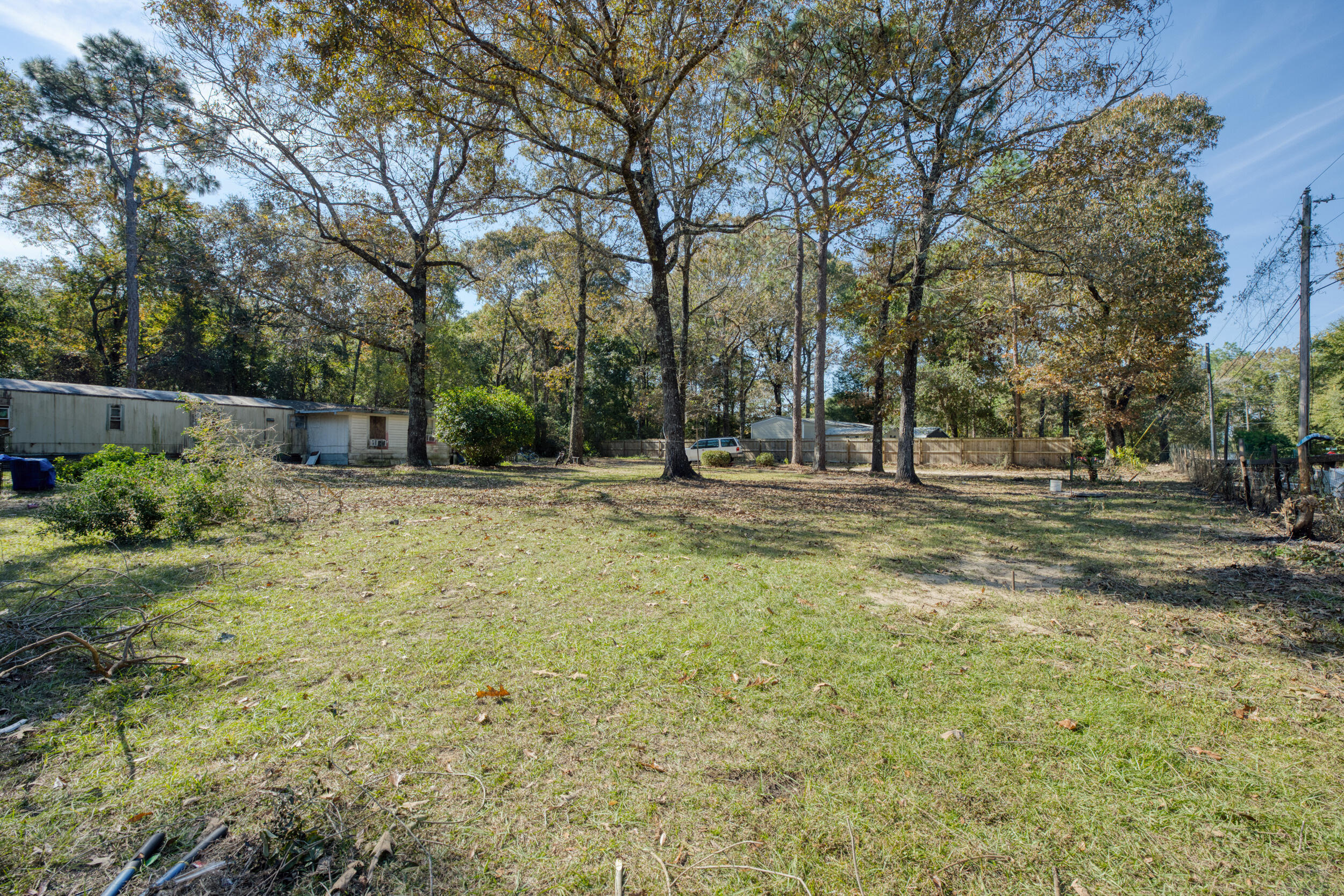 281 Pipers Landing Road DeFuniak Springs, FL 32433 - Photo 19 of 22 a backyard of a house with lots of green space and fountain