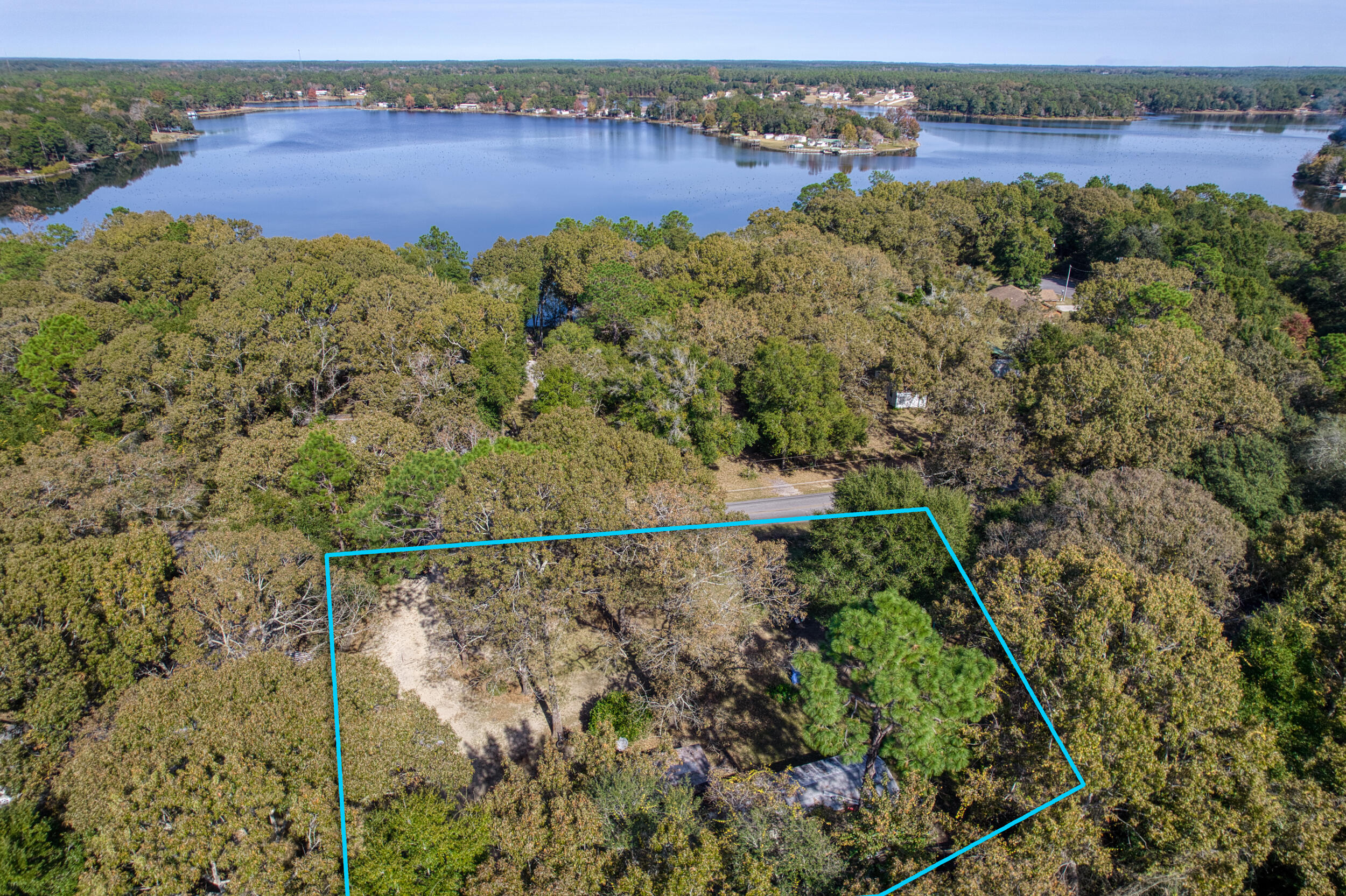 281 Pipers Landing Road DeFuniak Springs, FL 32433 - Photo 5 of 22 an aerial view of a house with a yard and lake view