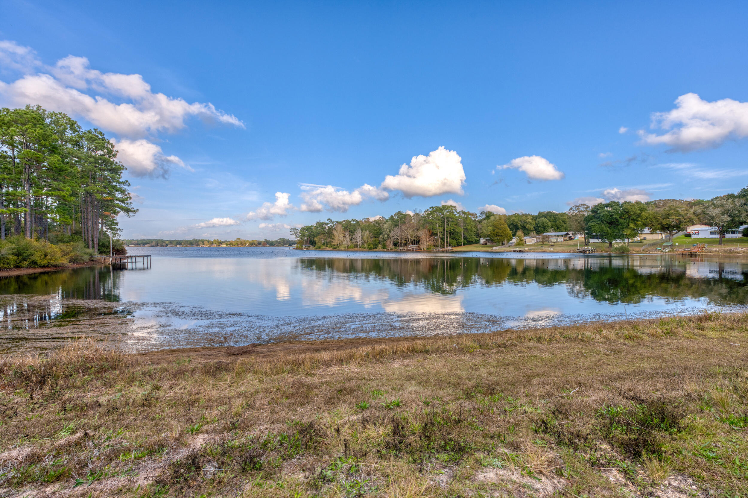 281 Pipers Landing Road DeFuniak Springs, FL 32433 - Photo 8 of 22 a view of a lake with houses in the back
