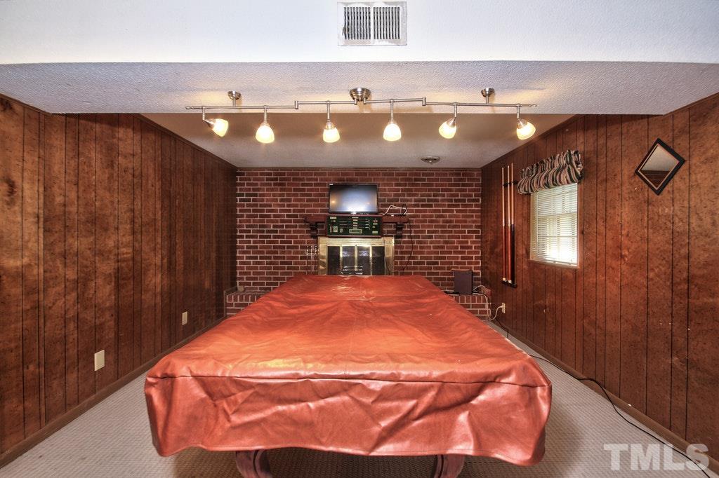 2908 New Hope Church Road Raleigh, NC 27604 - Photo 16 of 24 a locker room with a chandelier