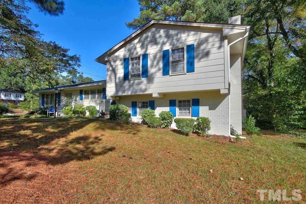 2908 New Hope Church Road Raleigh, NC 27604 - Photo 3 of 24 a front view of a house with garden