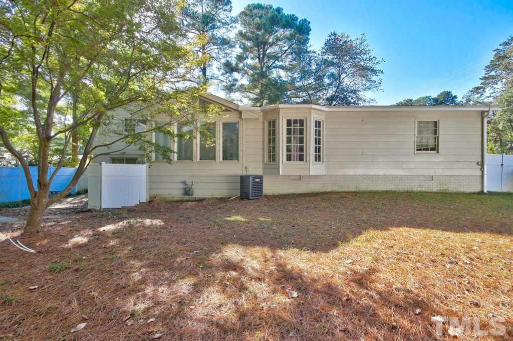 2908 New Hope Church Road Raleigh, NC 27604 - Photo 20 of 24 a view of a yard with a large tree
