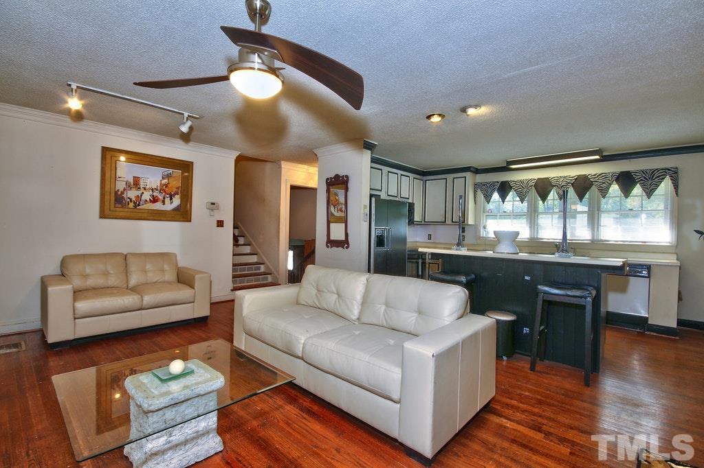 2908 New Hope Church Road Raleigh, NC 27604 - Photo 22 of 24 a living room with furniture and a large window