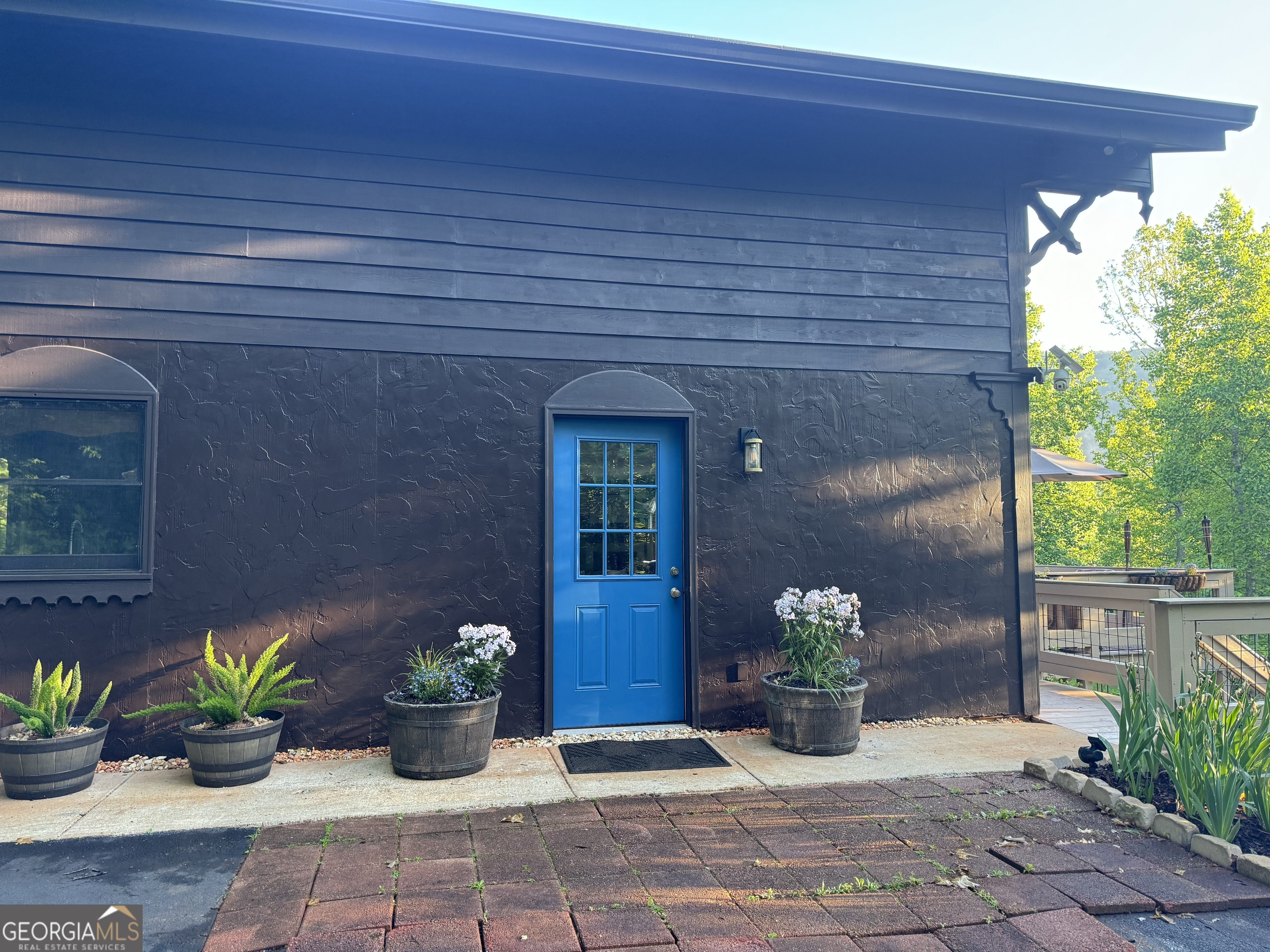 255 Prairie Flower Drive Cleveland, GA 30528 - Photo 8 of 11 a front view of a house with potted plants