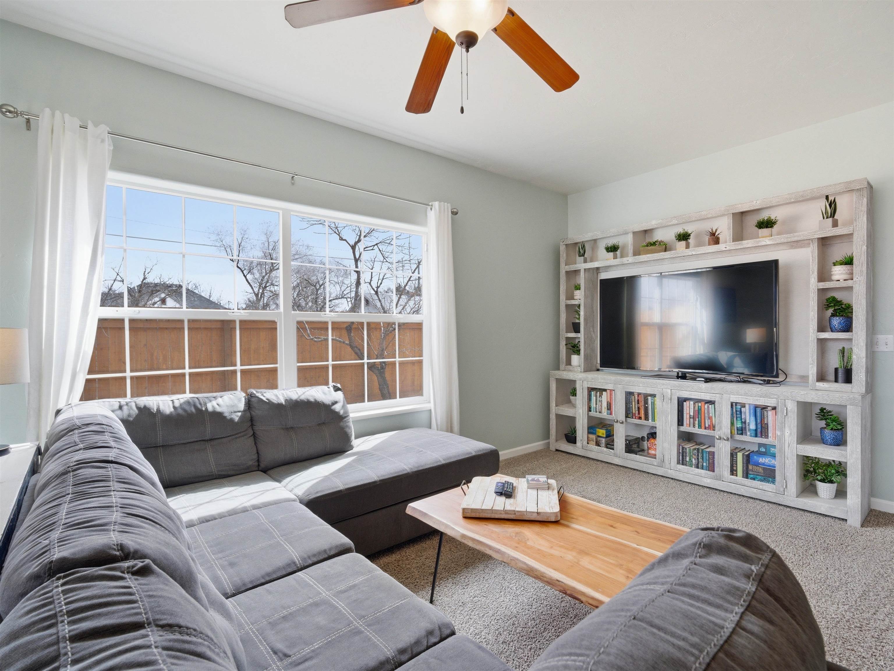 1163 Rood Avenue Grand Junction, CO 81501 - Photo 11 of 36 a living room with furniture and a flat screen tv