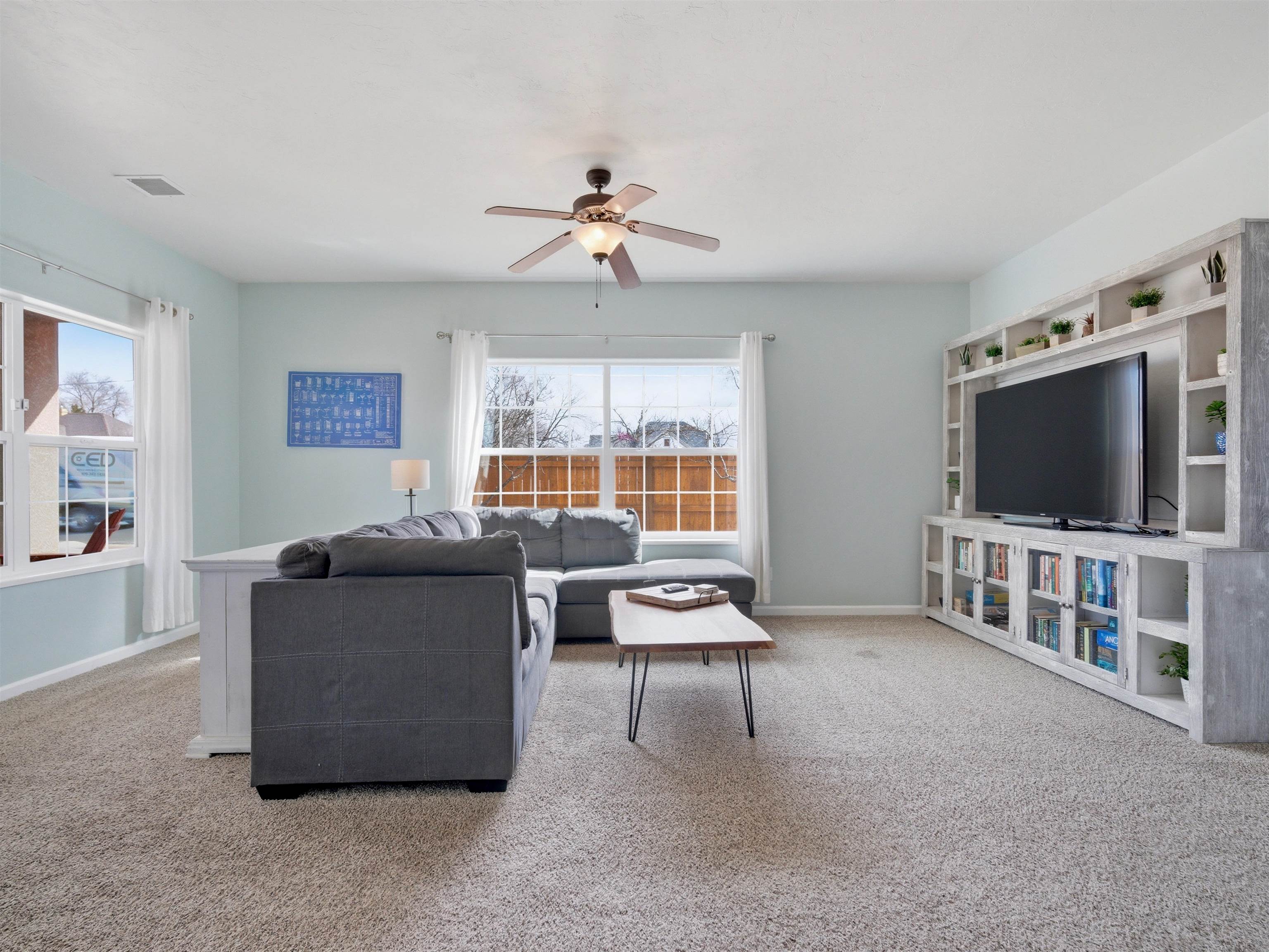 1163 Rood Avenue Grand Junction, CO 81501 - Photo 12 of 36 a living room with furniture and a flat screen tv