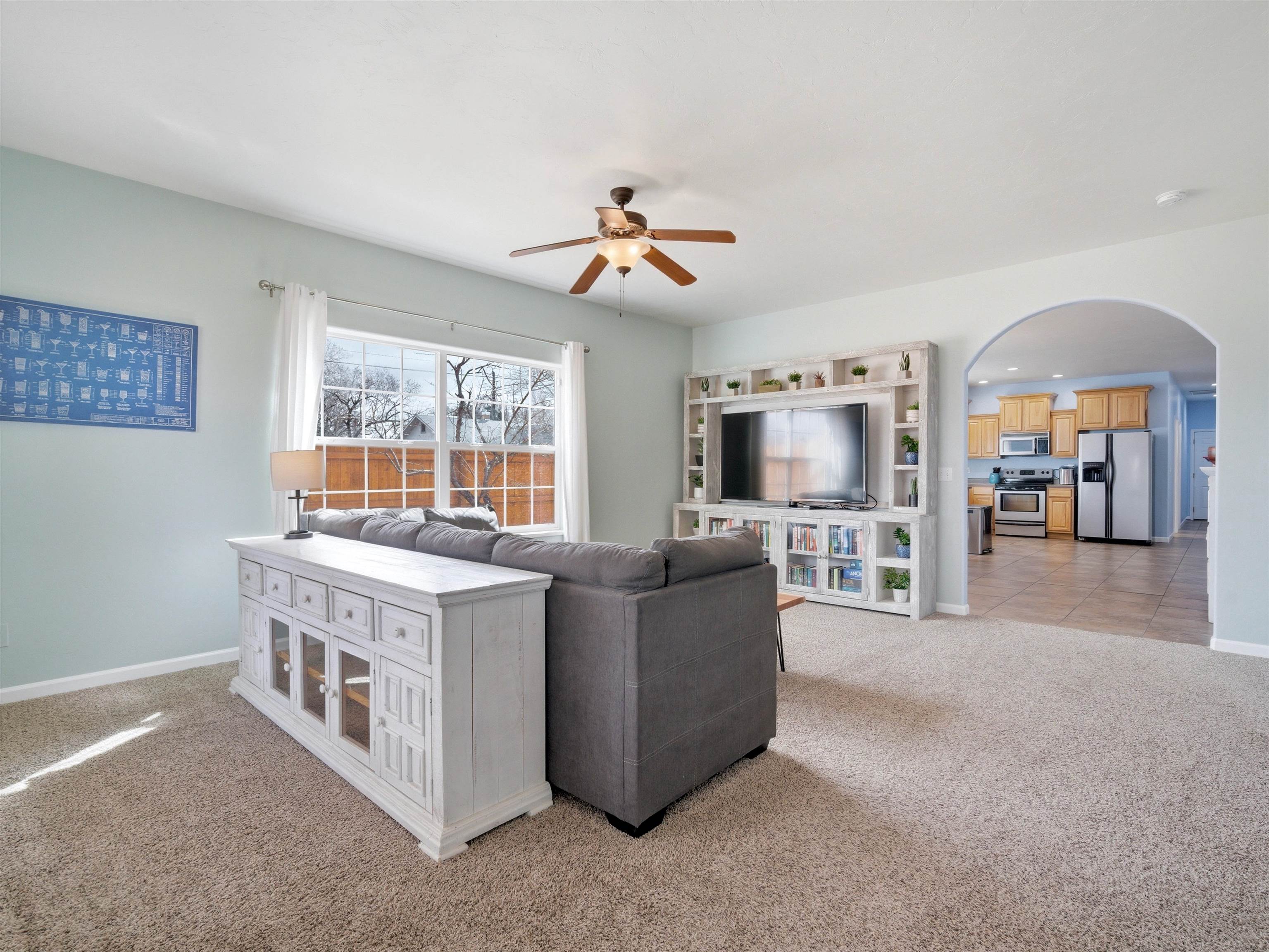 1163 Rood Avenue Grand Junction, CO 81501 - Photo 14 of 36 a living room with furniture and a chandelier