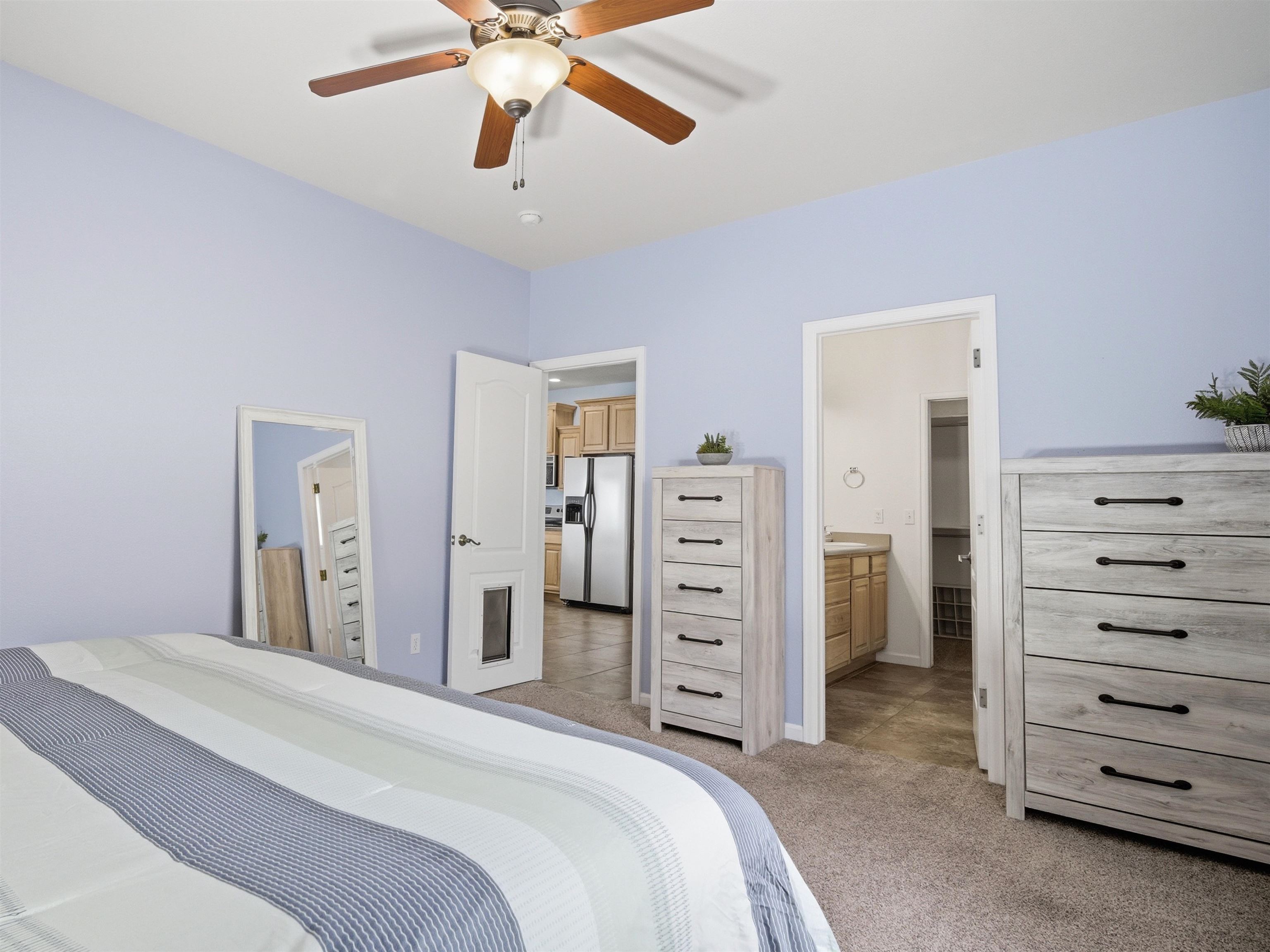1163 Rood Avenue Grand Junction, CO 81501 - Photo 18 of 36 a bedroom with a bed and a dresser