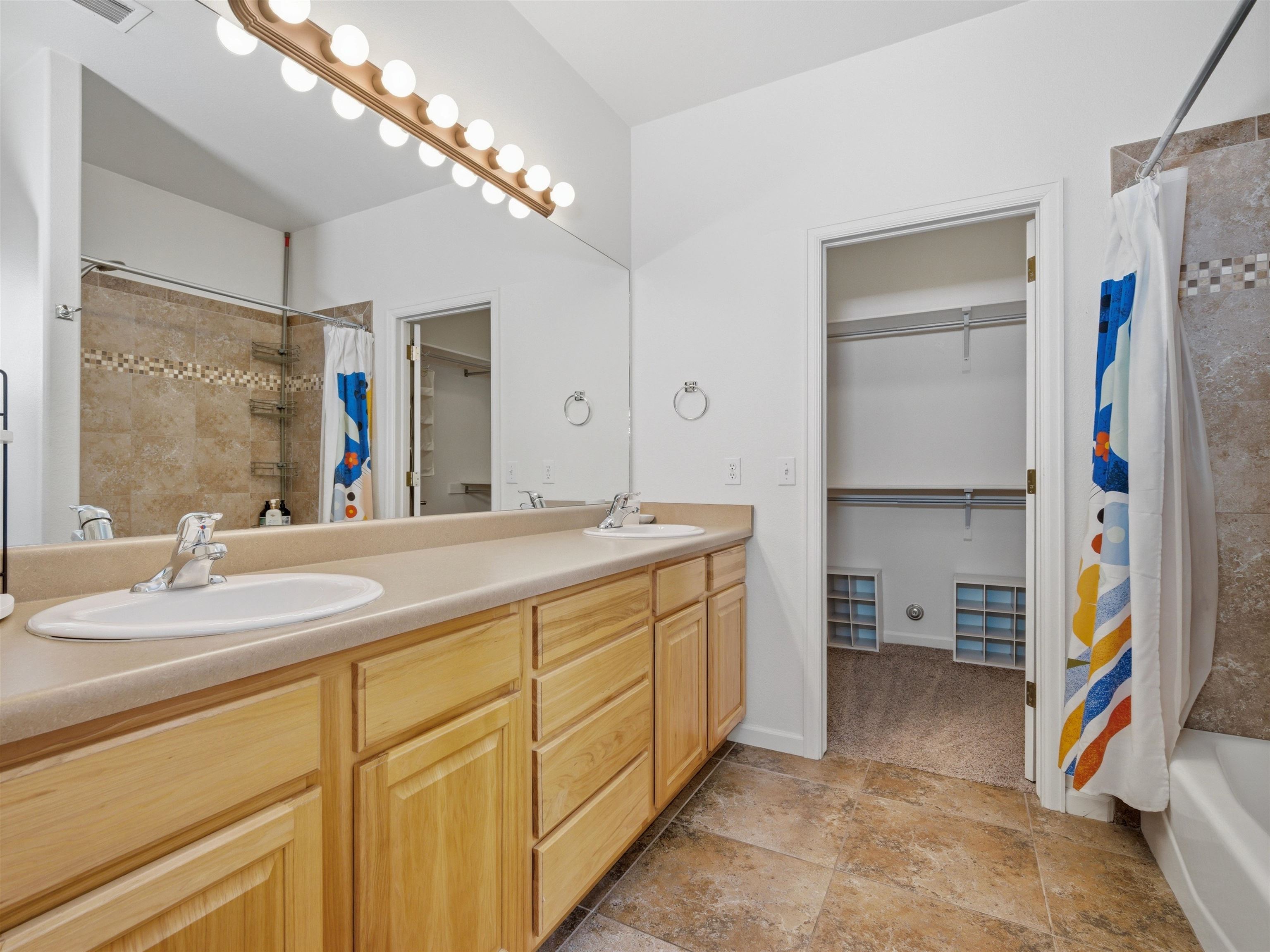 1163 Rood Avenue Grand Junction, CO 81501 - Photo 19 of 36 a bathroom with a sink double vanity and a mirror