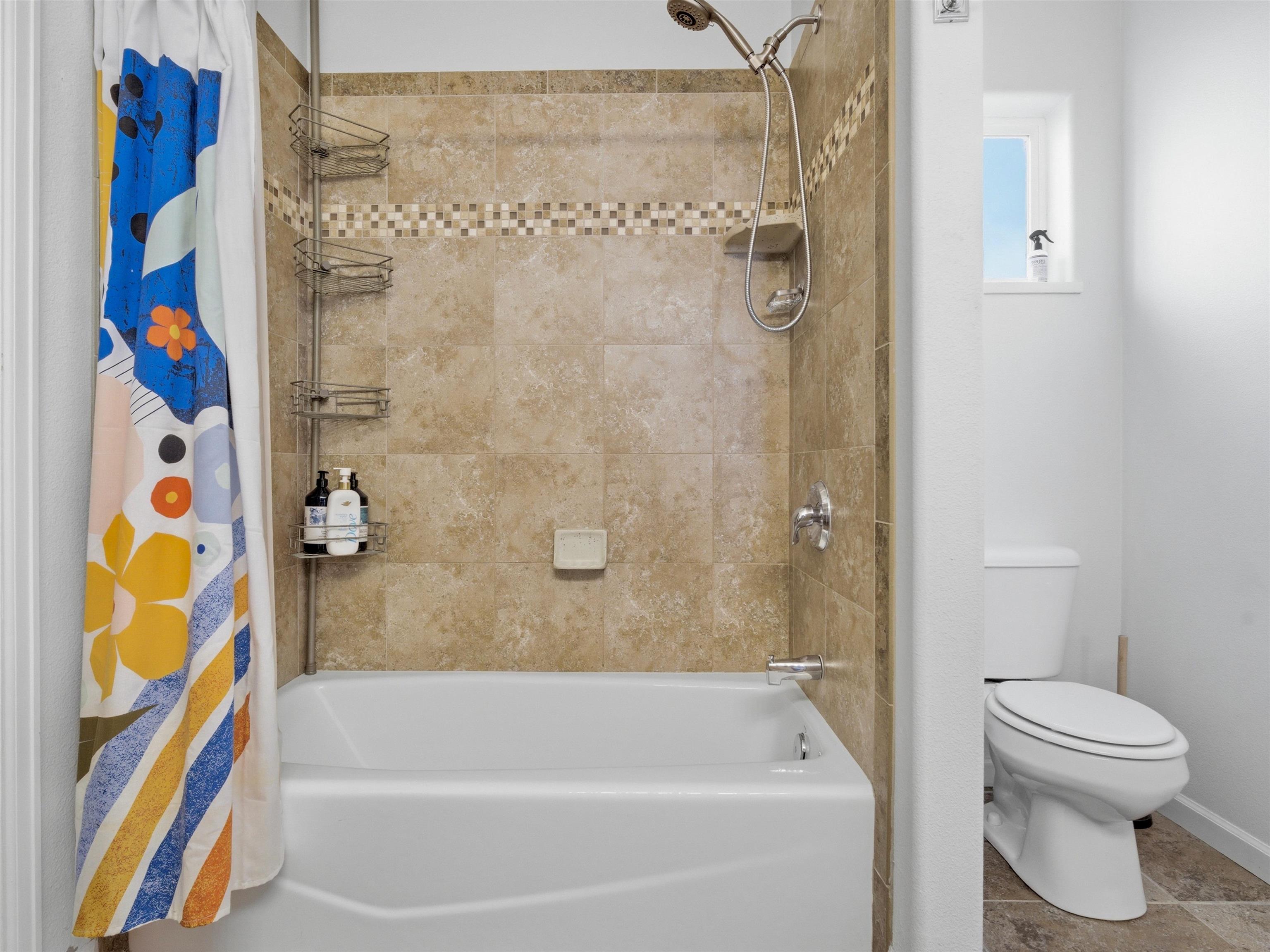 1163 Rood Avenue Grand Junction, CO 81501 - Photo 20 of 36 a bathroom with a bathtub and a shower