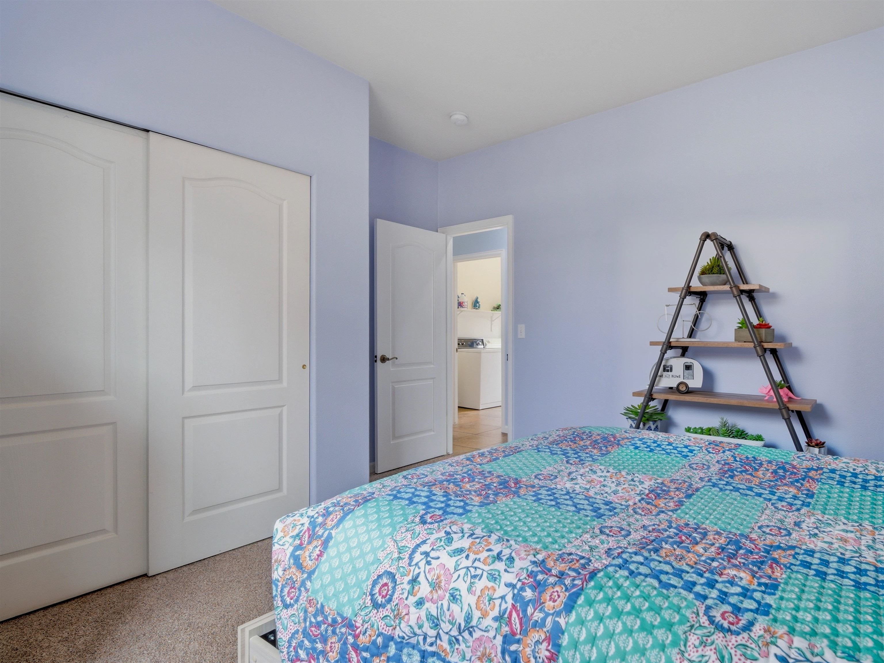 1163 Rood Avenue Grand Junction, CO 81501 - Photo 23 of 36 a bedroom with a bed and a bathroom