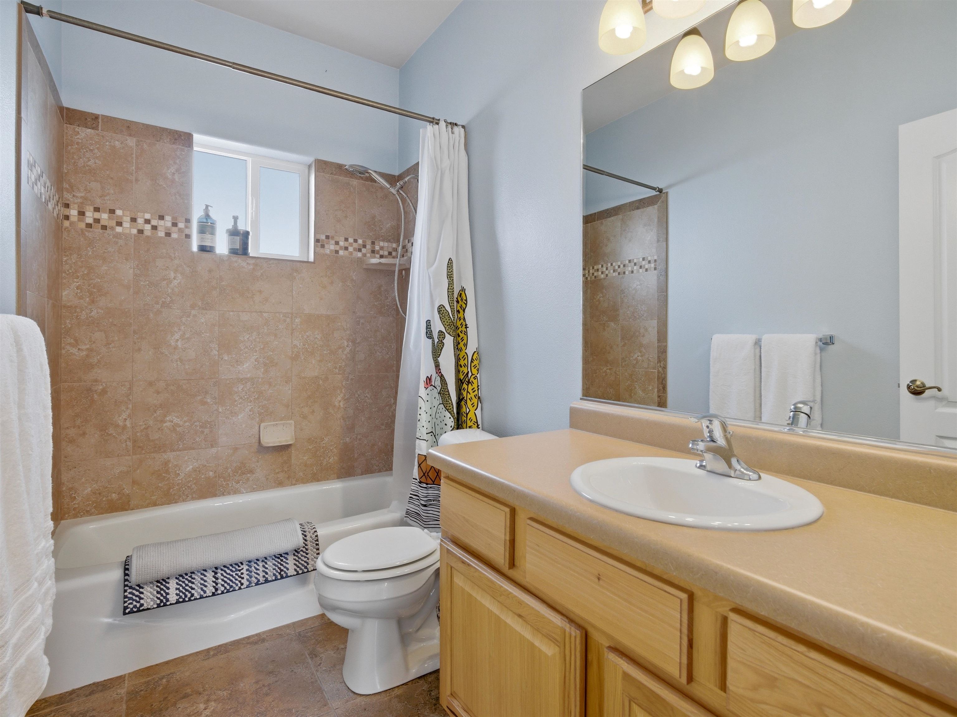 1163 Rood Avenue Grand Junction, CO 81501 - Photo 24 of 36 a bathroom with a sink a toilet and shower