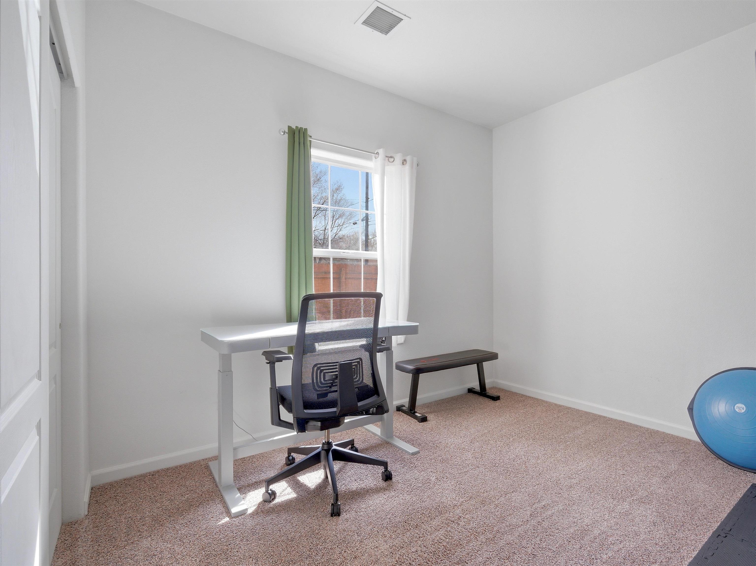 1163 Rood Avenue Grand Junction, CO 81501 - Photo 25 of 36 a view of a workspace with furniture and a window