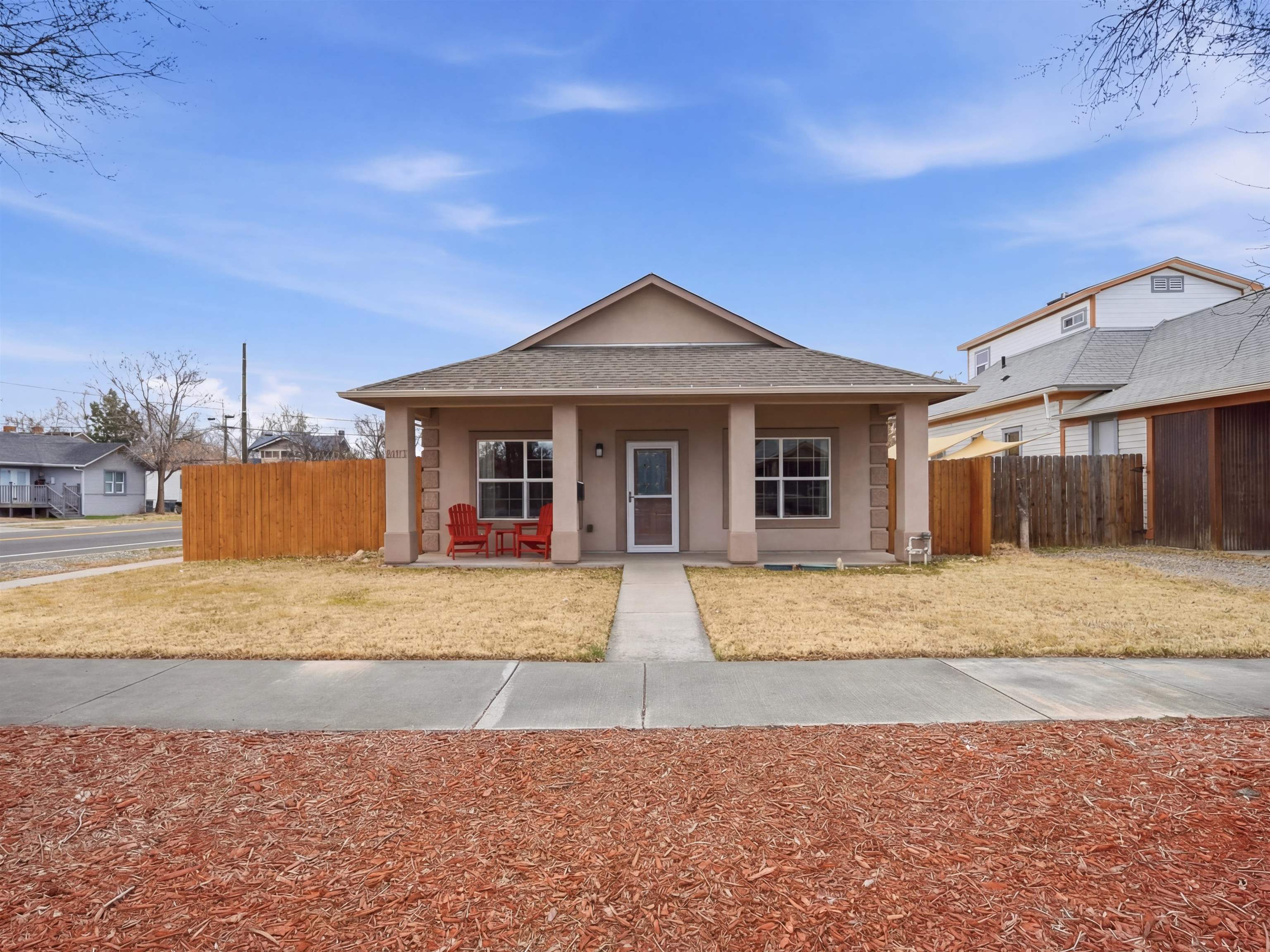 1163 Rood Avenue Grand Junction, CO 81501 - Photo 34 of 36 a front view of a house with a yard