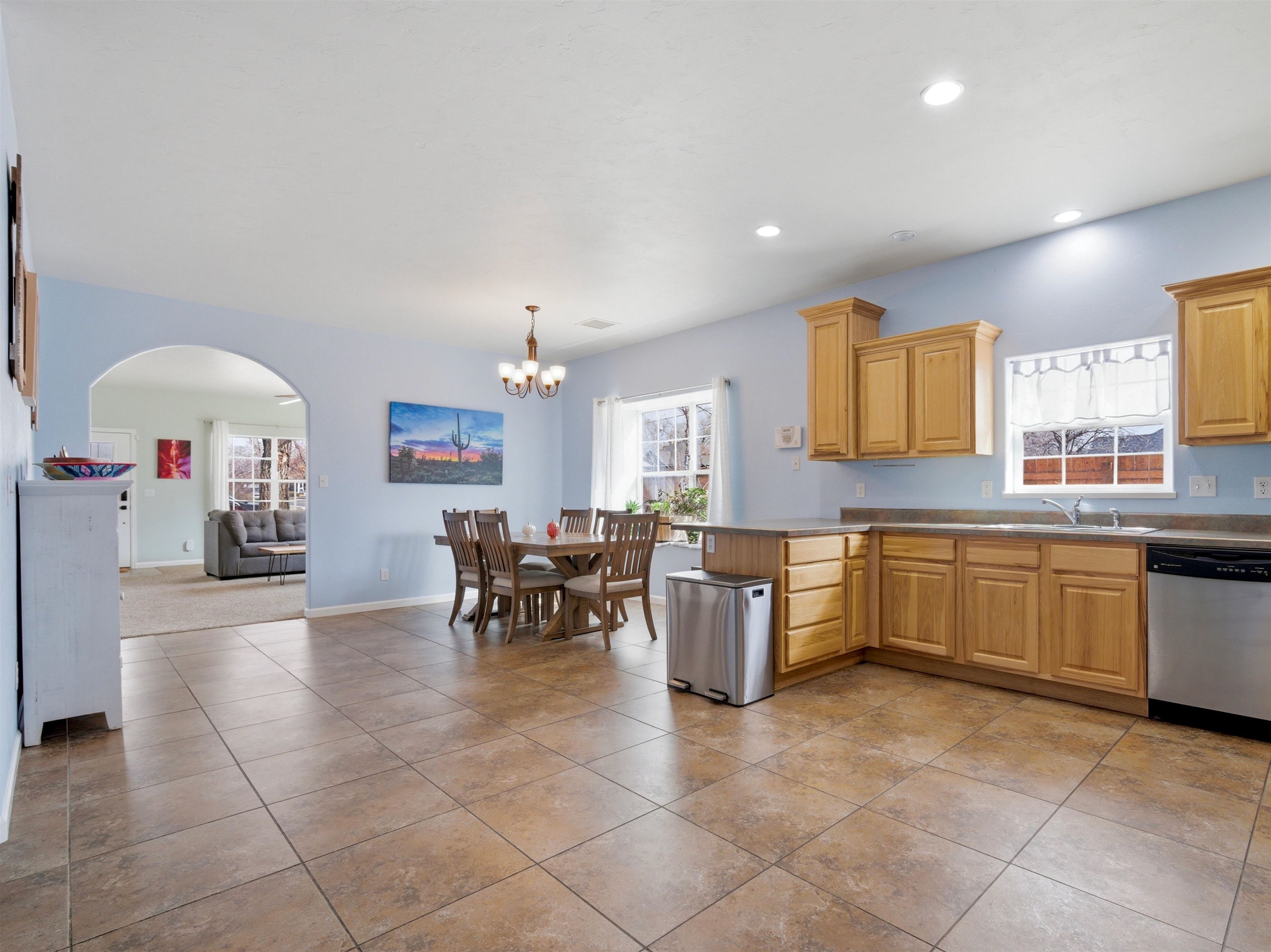 1163 Rood Avenue Grand Junction, CO 81501 - Photo 4 of 36 a kitchen with a sink dining table and chairs