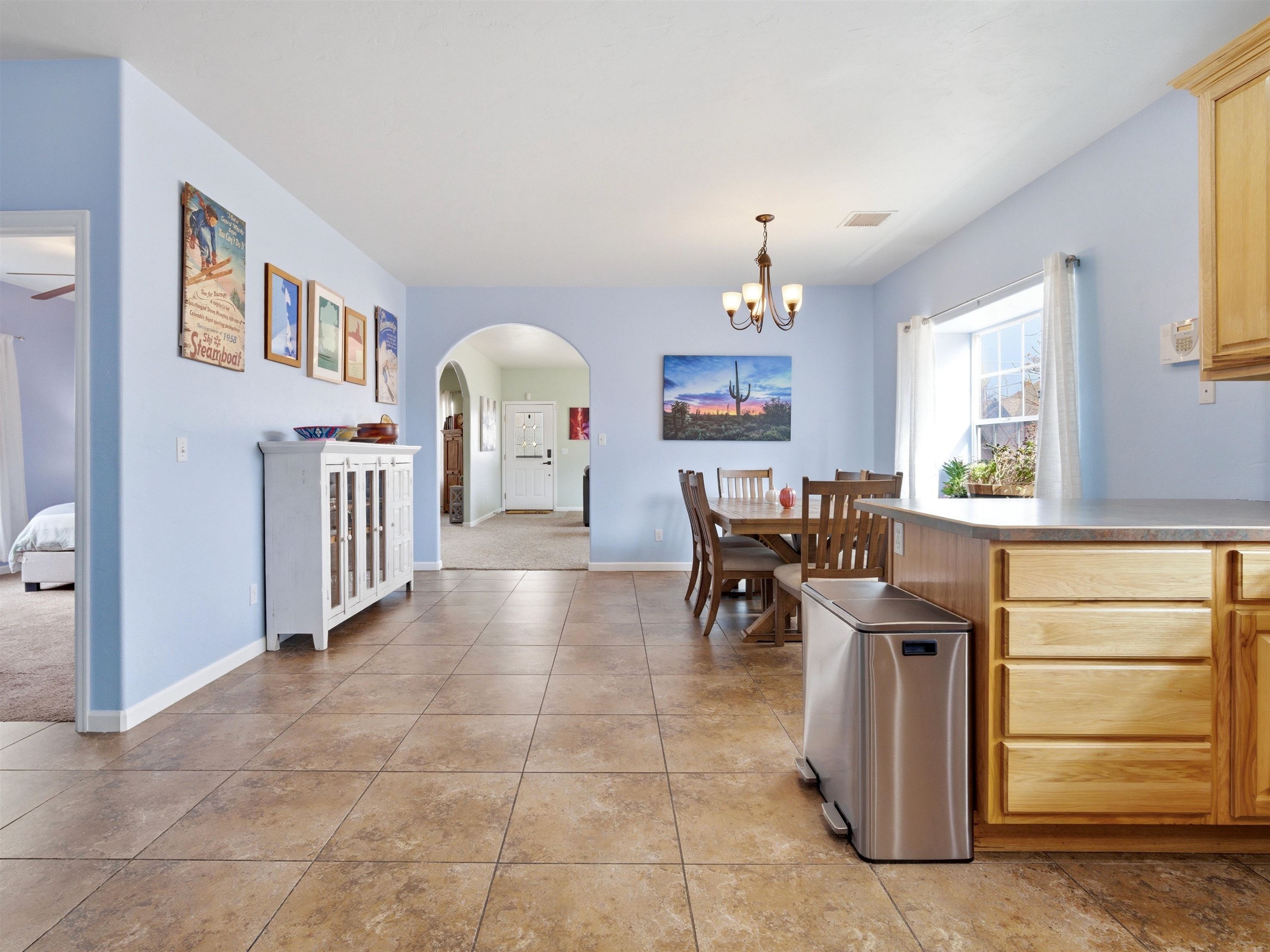 1163 Rood Avenue Grand Junction, CO 81501 - Photo 7 of 36 a view of a dining room with furniture and a chandelier