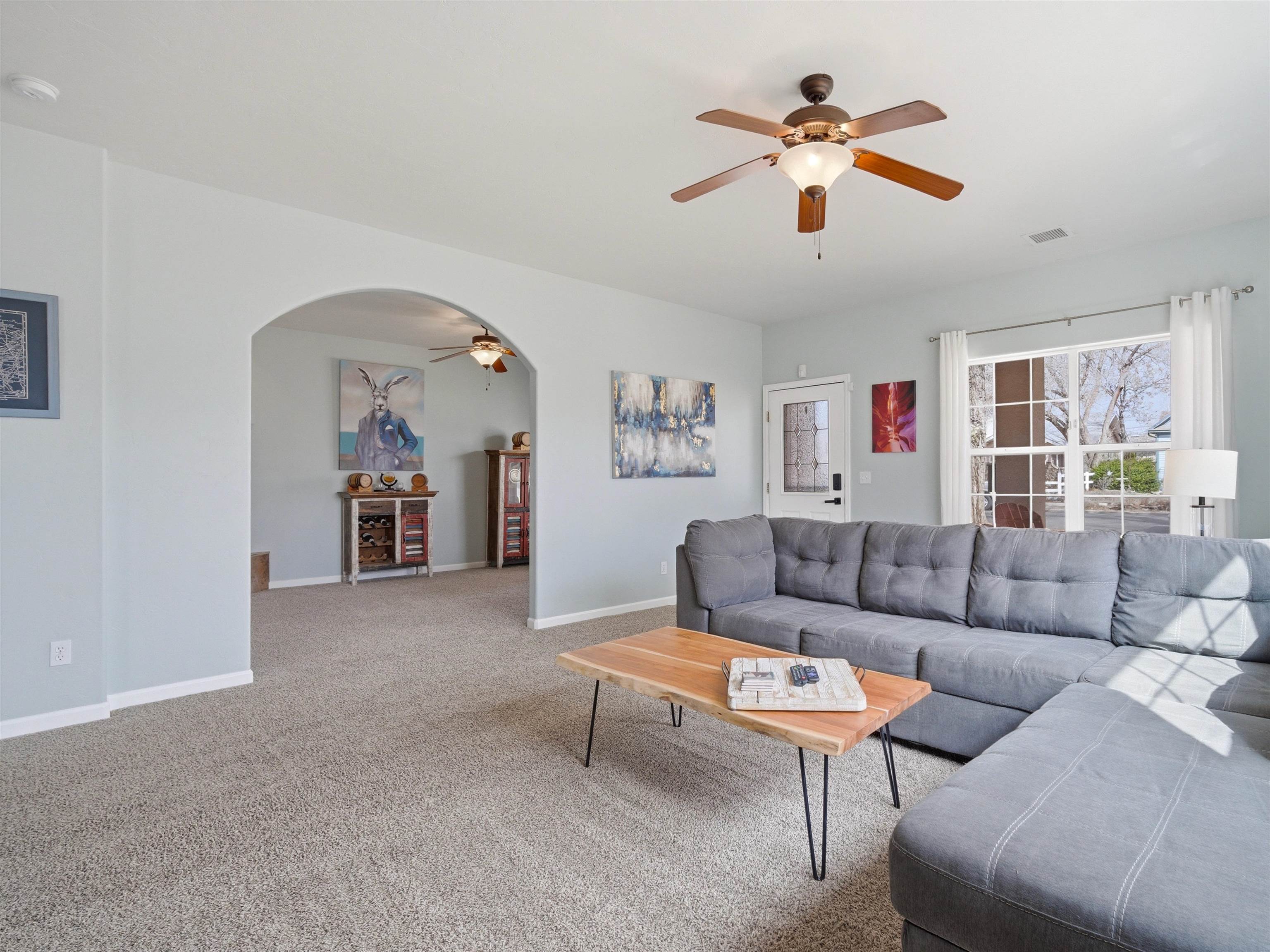 1163 Rood Avenue Grand Junction, CO 81501 - Photo 10 of 36 a living room with furniture and a ceiling fan