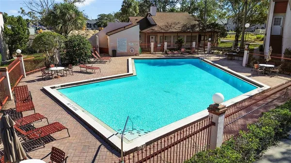 a view of a backyard with sitting area