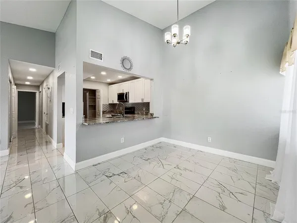 a view of a livingroom with furniture and a chandelier