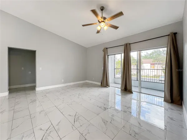 a view of an empty room with a window