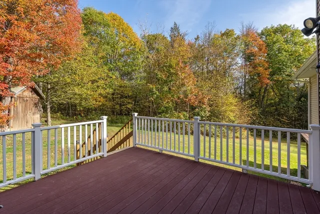 a view of a balcony with wooden fence