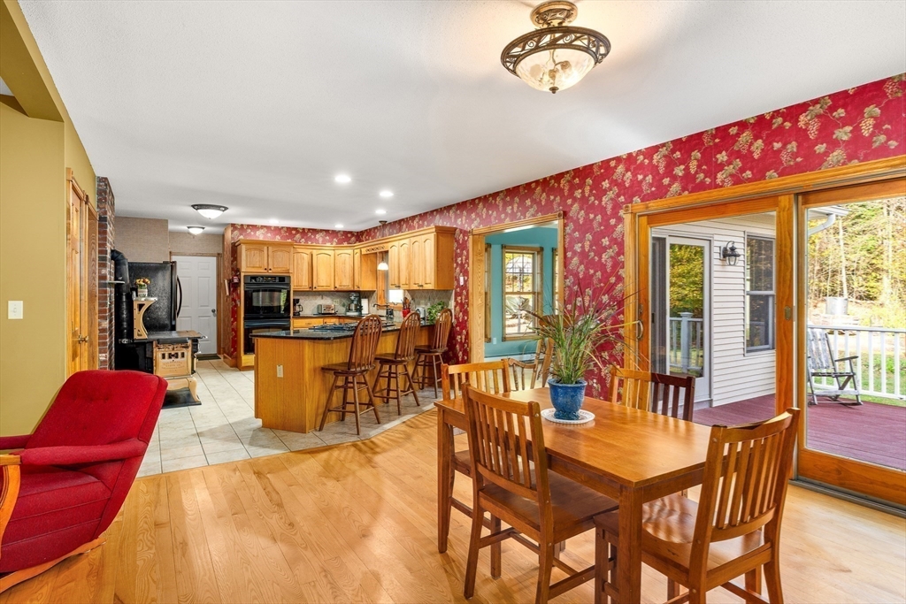 254 Bryant Street Chesterfield, MA 01012 - Photo 18 of 41 a dining room with furniture a rug and a chandelier