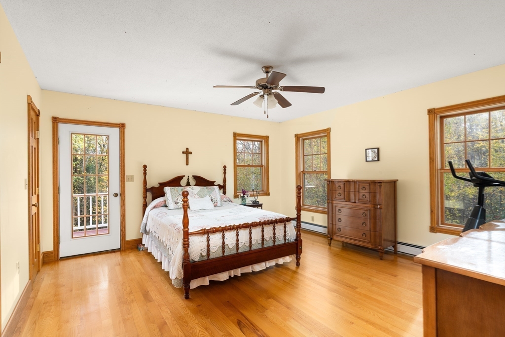 254 Bryant Street Chesterfield, MA 01012 - Photo 21 of 41 a bedroom with a bed and wooden floor